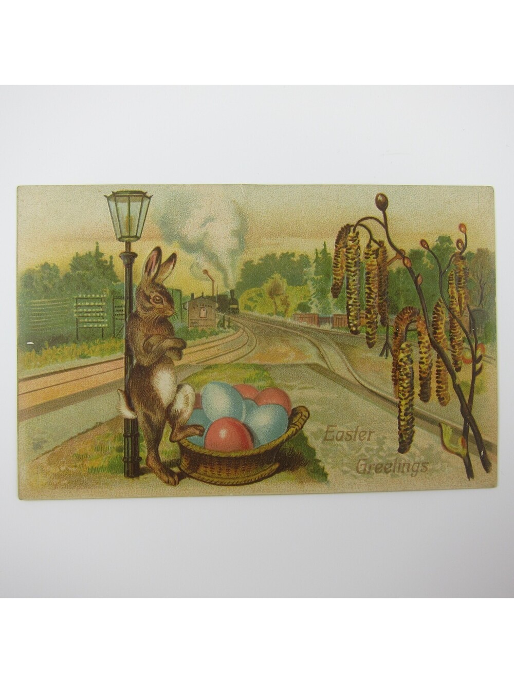 Easter Postcard Rabbit Waits for Train with Basket Colored Eggs Embossed Antique